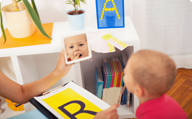 Toddler observing self in mirror