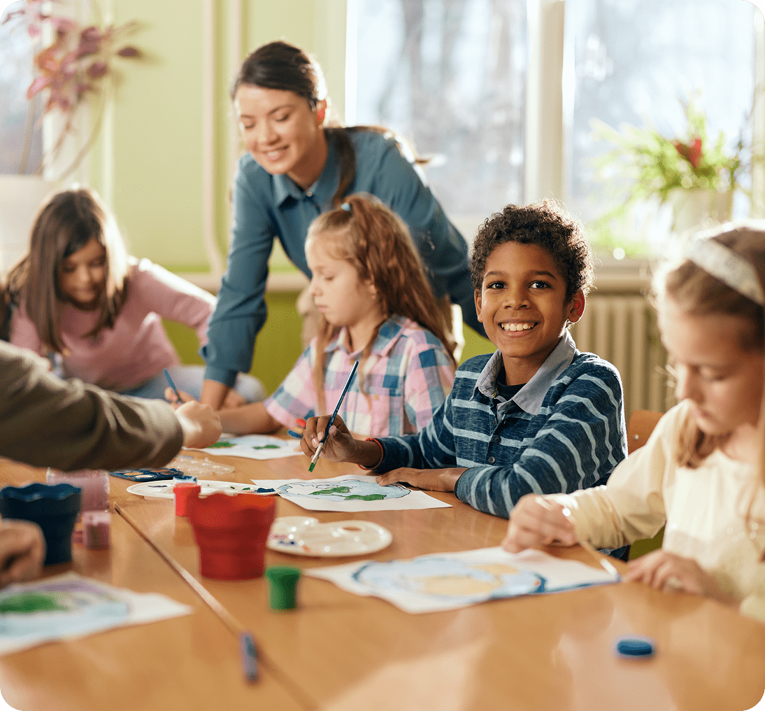 Children painting in a classroom