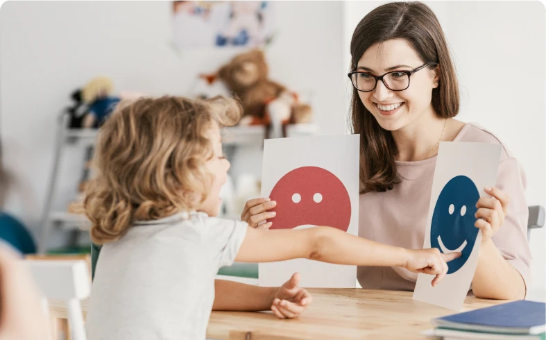 Child learning emotions with teacher