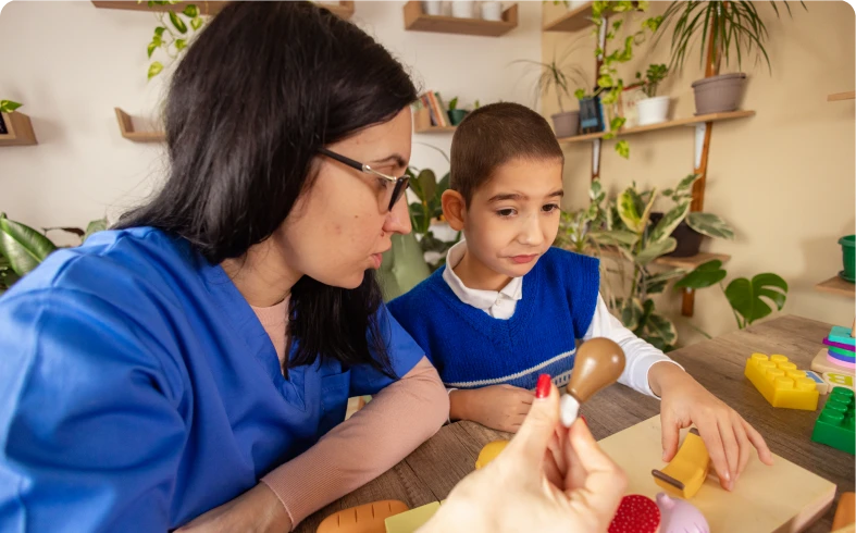 Woman and boy engaging in learning activity
